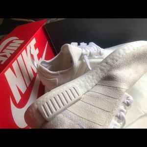 Men’s Adidas tennis shoe .